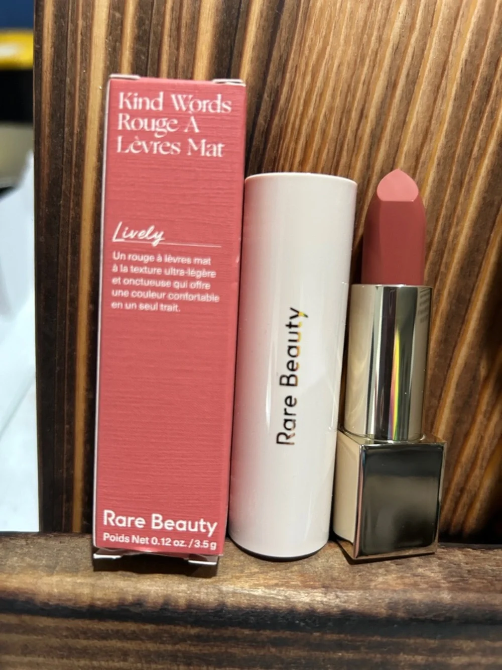 Rare Beauty lipstick and setting powder in medium-deep